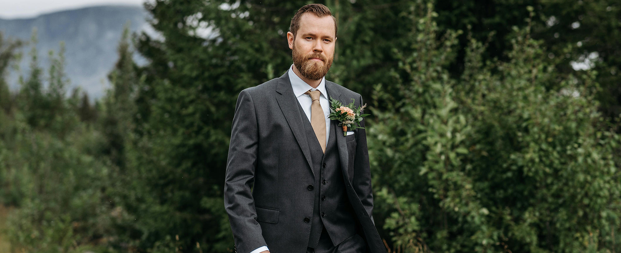 mens black suit and vest white shirt with champagne tie