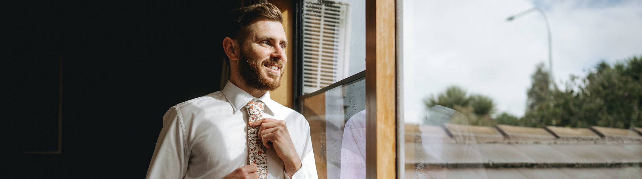 men wearing white floral men's necktie 