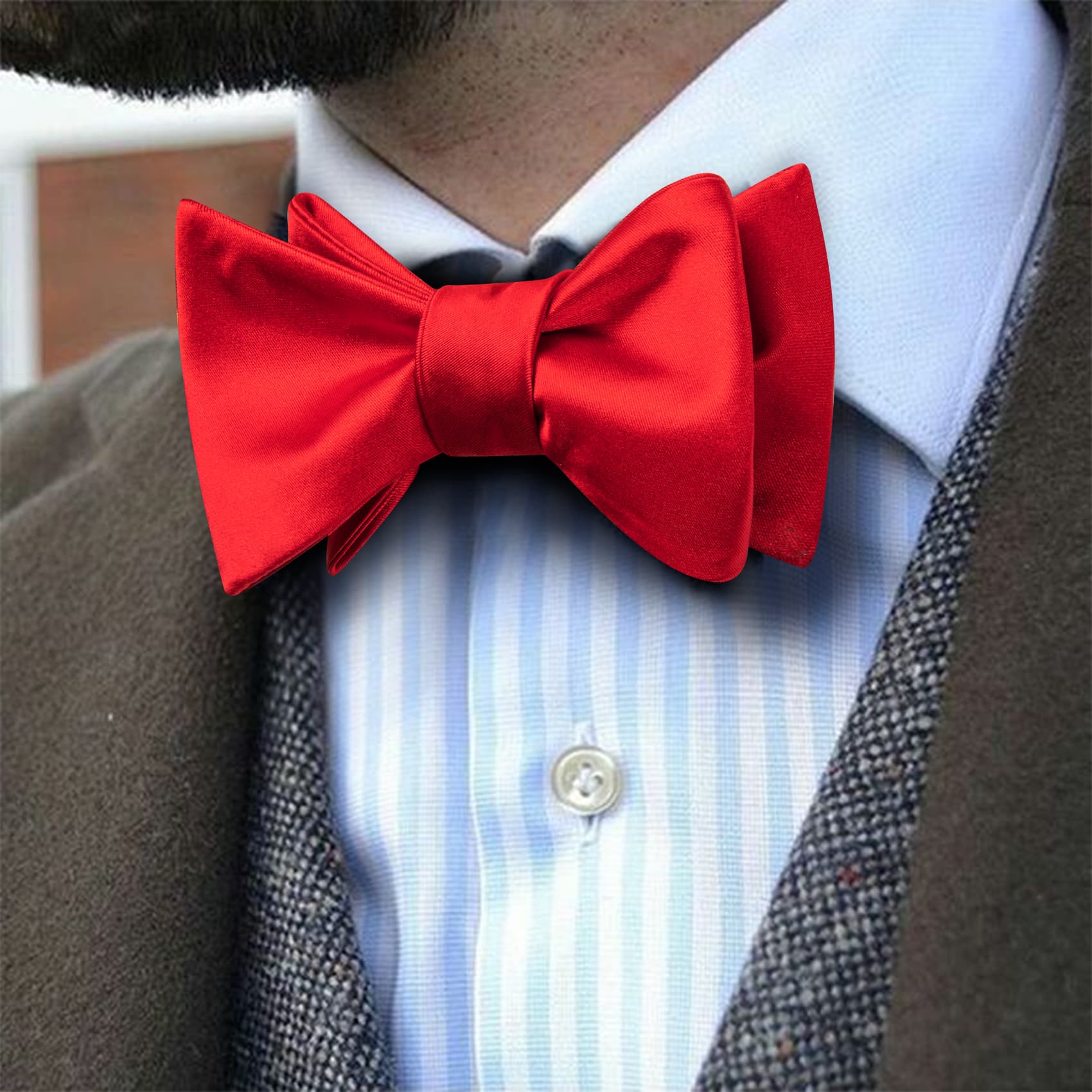 Brown suit jacket with red bow tie red bow tie logo